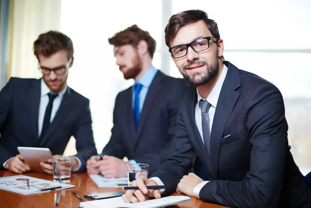 Well-dressed executive with co-workers background Lawyer Website Development
